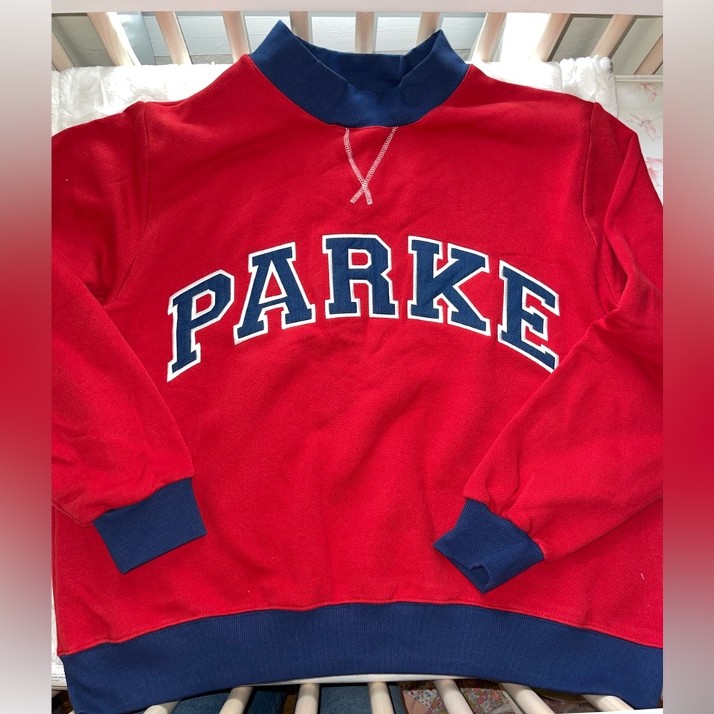 Parke Two Tone Varsity Mockneck in Firecracker color. Size L/XL. Sold out online